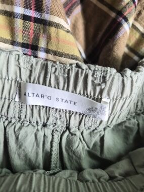 Altar'd State Olive Green Elastic Waist Shorts with Plaid Lining.